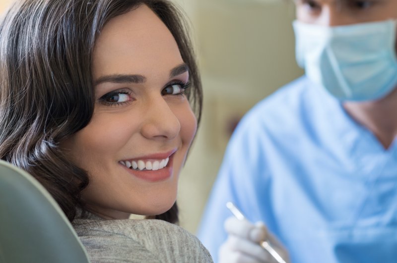 A dentist in Gahanna seeing a smiling patient.